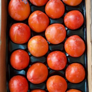 A big box of hachiya persimmons