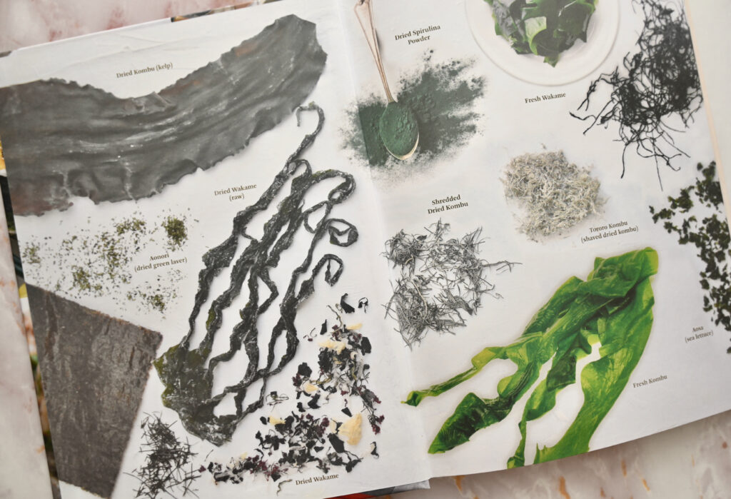 Japanese Superfoods cookbook opened to inside jacket with pictures of sea plants