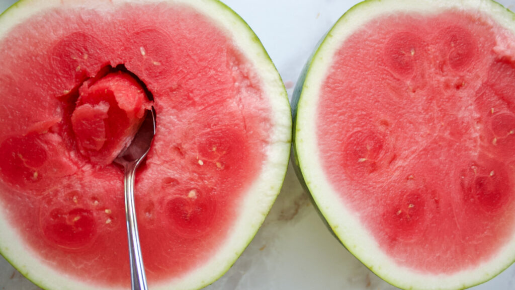 ripe juicy watermelon with a scoop taken out
